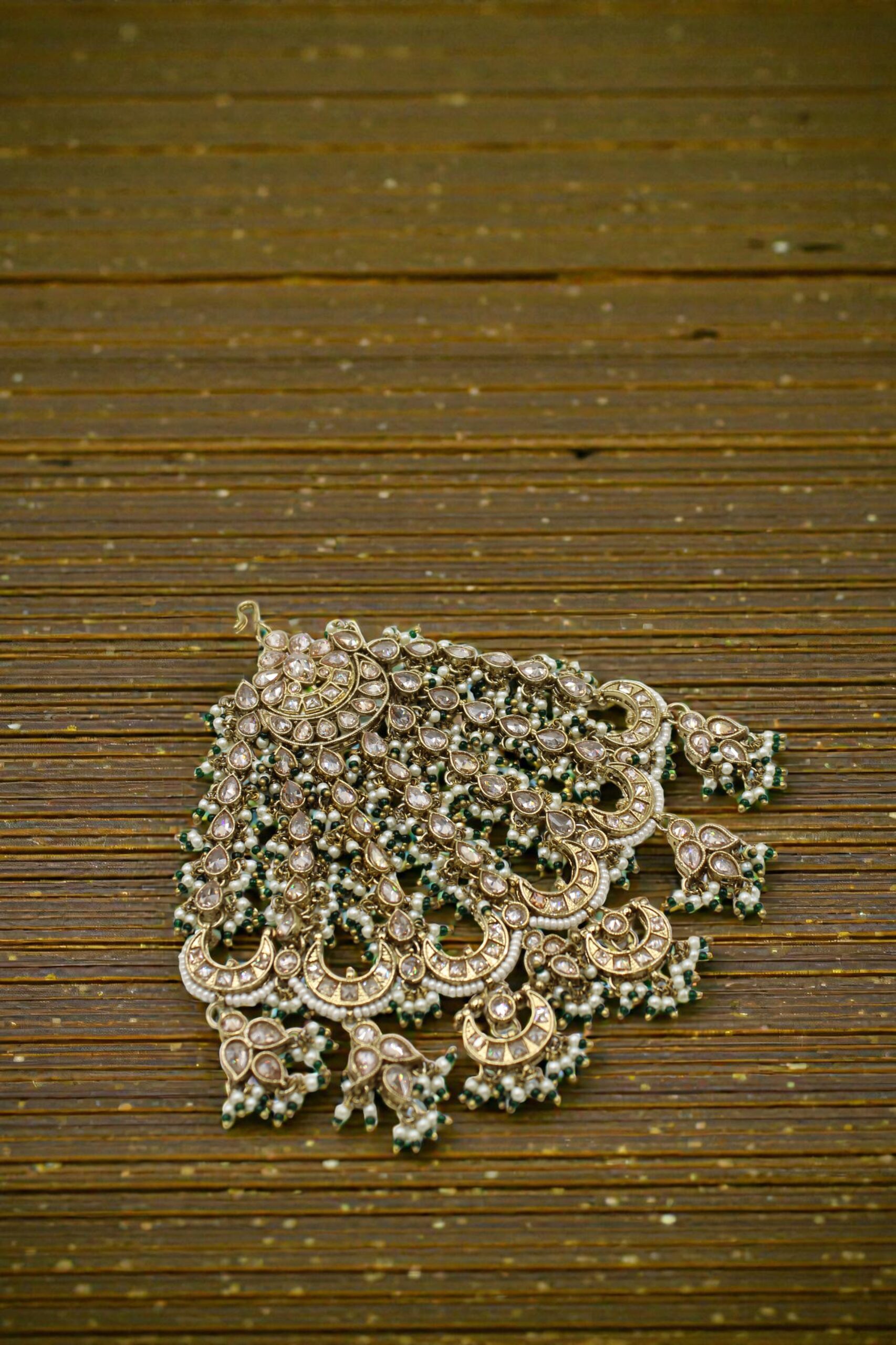Intricate Traditional Indian Jewelry with Pearls and Green Accents - Image 3